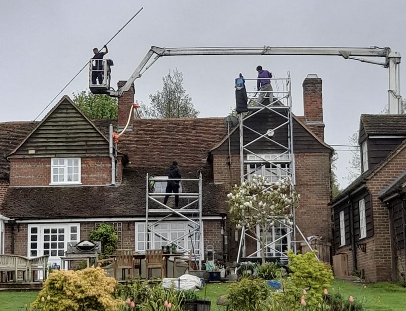The Roof Moss Cleaners using cherry picker and scaffolding to clean roof safely and professionally in Purton, Wiltshire