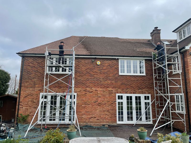 Roof cleaning carried out safely from scaffold towers by The Roof Moss Cleaners in Purton